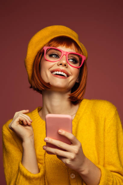 istock Beautiful emotional woman using phone 1483507309