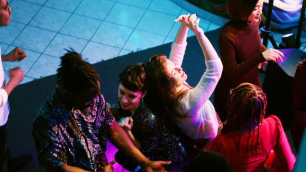 istock Happy persons clubbing together at night 1483507548