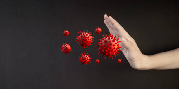 istock Human hand shows stop to the flying virus. Medicine concept. 1483508601