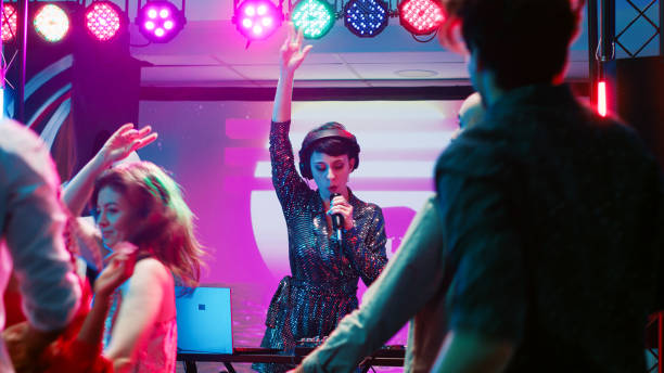 istock Funky woman putting music on stage 1483509050