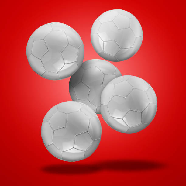 istock Floating leather Soccer balls against red  gradient background 1483510979