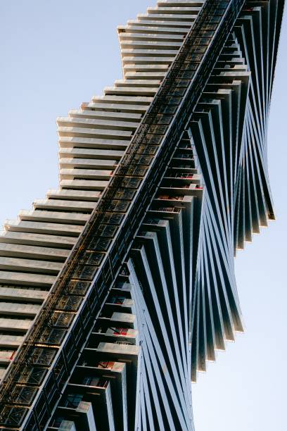 istock Low-angle shot of a modern skyscraper with a distinct wavy architectural design. 1483514559