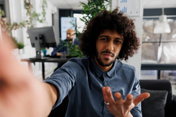 istock Product manager discussing project with client on smartphone videocall 1483515572
