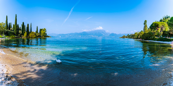 Lake Garda, eastern side. Punta San Vigilio. The still waters of the lake during the last days of summer.