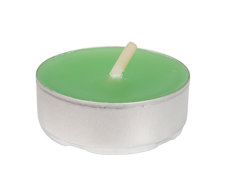 Small tealights candle isolated over white background