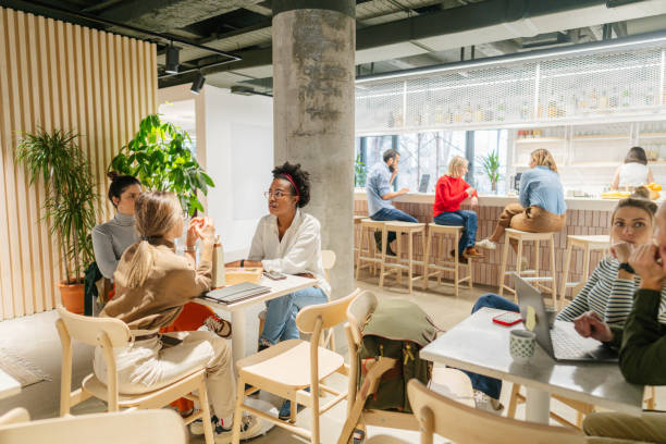 istock Colleagues taking a coffee break in the office cafeteria 1483517731