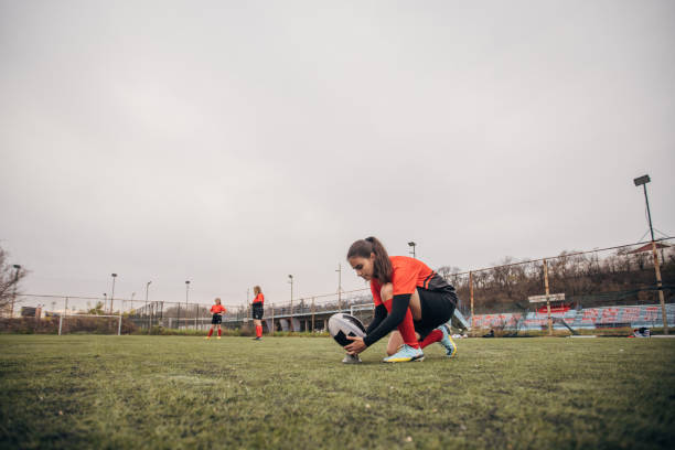 istock Female rugby player shooting a penalty 1483520382
