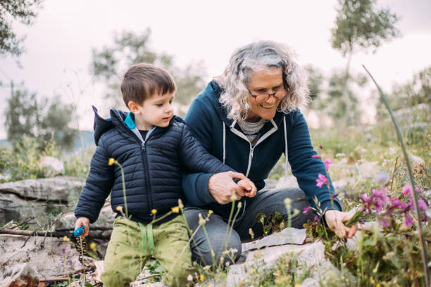 istock grandma and granddaughter picking flowers 1483530320