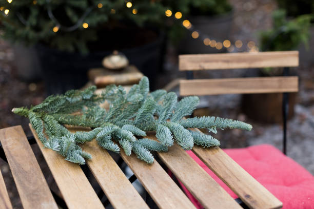 istock Christmas tree branch on wooden table 1483531134