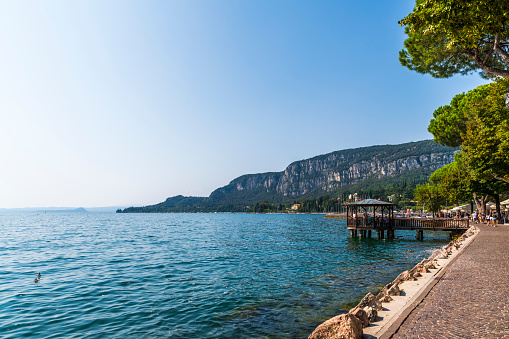 Lake Garda, eastern side. Malcesine and Riva del Garda. The still waters of the lake during the last days of summer.