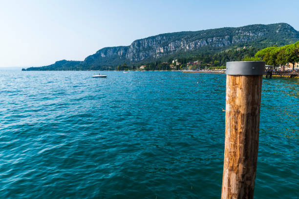 Lake Garda, eastern side. Malcesine and Riva del Garda. The still waters of the lake during the last days of summer.