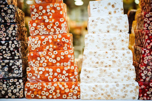 Pieces of delicious nougat as background, closeup