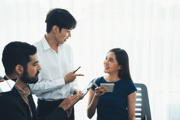 istock Asian office workers in office discussing and working together. Concord 1483541202