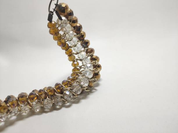 istock necklace brown, white, and gold crystal beads 1483542148