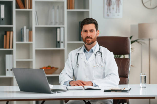 istock In the cabinet. Doctor in formal clothes is working 1483542201