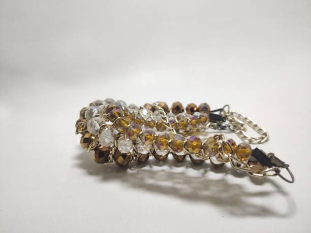 istock necklace brown, white, and gold crystal beads 1483542400
