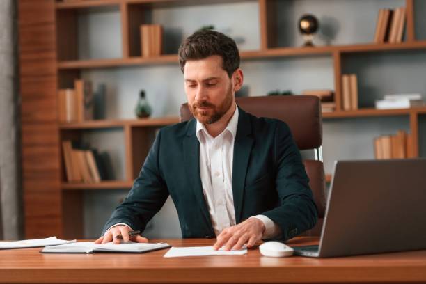 istock Businessman in formal clothes is working indoors 1483542580