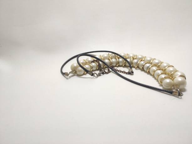 istock necklace pearl uses a chain. white background 1483543104