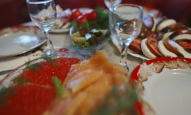 istock Feast in the Soviet style. Snacks and glasses of vodka. 1483545753