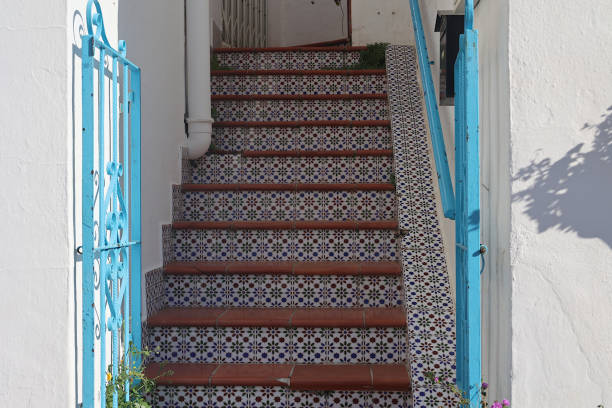 Beautiful Tile Staircase This tile staircase was seen in Mijas Pueblo, a white village in the Andalusian province of Spain.  The fine artwork appears to have been painstakingly done for the perfect pattern achieved. mijas pueblo stock pictures, royalty-free photos & images