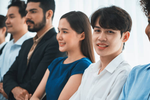 istock Multiracial office worker hold hand in a line promoting synergy. Concord 1483546997