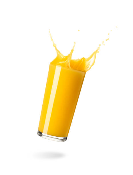 istock Orange juice splash in a glass on white background 1483551953