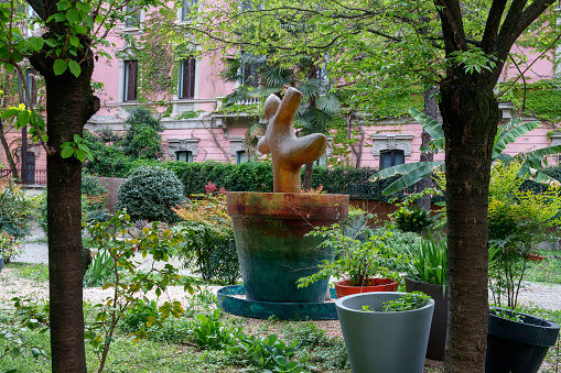 Milan, Italy - April 8, 2023: Milan, Lombardy, Italy: garden along via Marco de Marchi