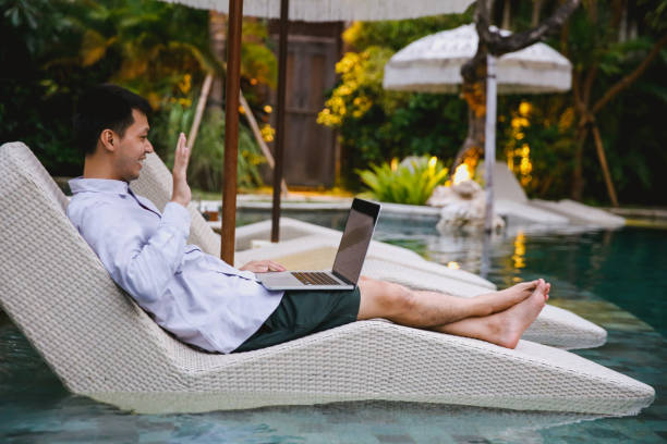 istock Asian Male Influencer Greeting Followers via Web Conference 1483556437