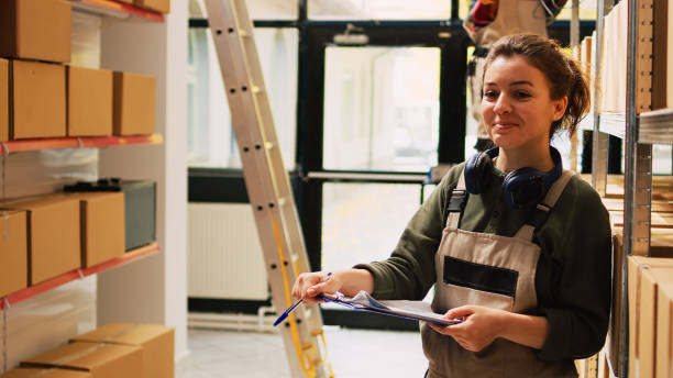 istock Employee working on inventory stock list 1483560037
