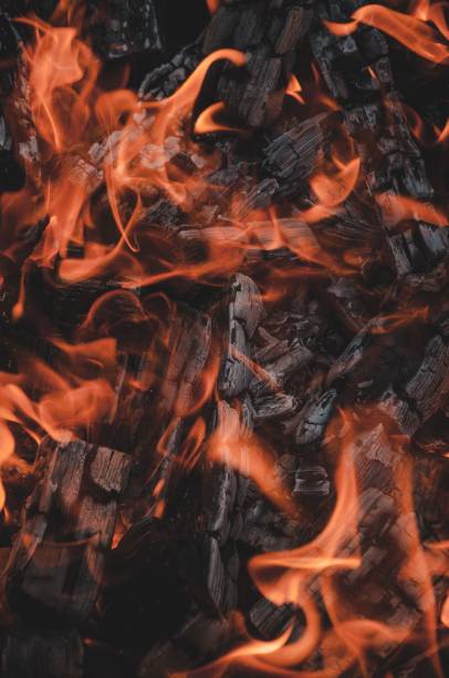 istock Close-up of a charcoal burner with glowing flames emanating from it 1483561565
