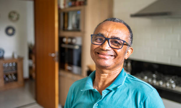istock Smiling senior man standing in his kitchen at home 1483563424