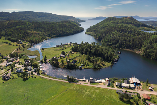 A village at a coastal inlet in the High Coast / Höga Kusten landscape in Ångermanland, Sweden.