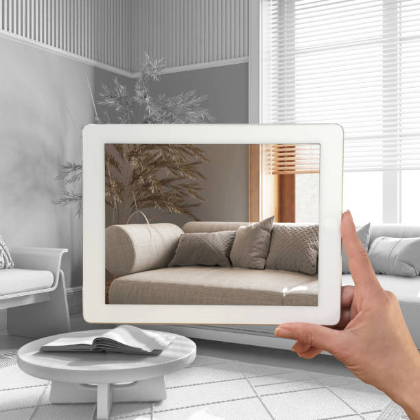 istock Augmented reality concept. Hand holding tablet with AR application used to simulate furniture products in custom architecture design, total white background, japandi living room 1483567218