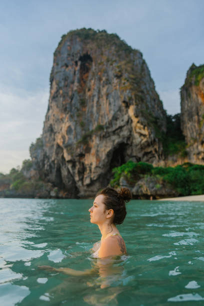 istock Woman swimming at sunset 1483569003