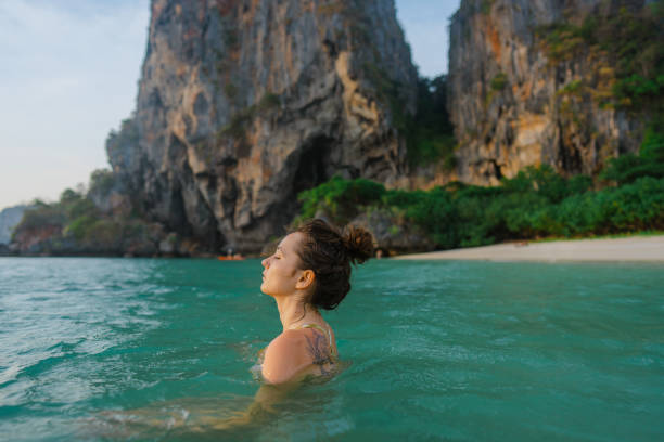istock Woman swimming at sunset 1483569004