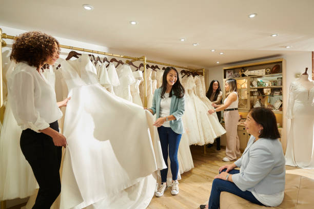 istock choosing the wedding dress with mum 1483569516