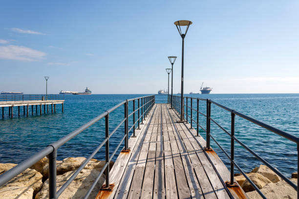 Empty sea pier with street lights on Molos promenade in Limassol, Cyprus