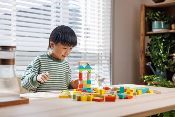 istock A little boy is playing with building blocks on the balcony 1483572020