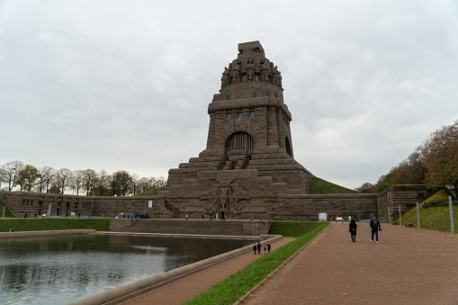 Leipzig, Germany – November 24, 2022: The gigantic monument Battle of the Nations in Leipzig with artificial lake in front and tall statues inside