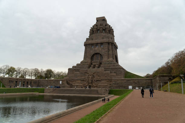 The gigantic monument Battle of the Nations in Leipzig with artificial lake in front and tall statues inside stock photo