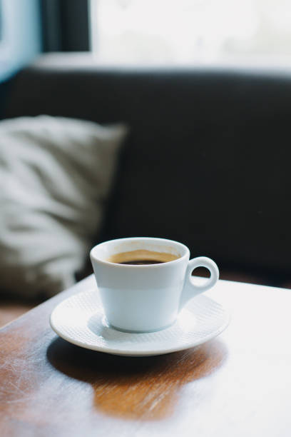 istock Cup of black coffee on a table in a cafe. Selective focus. 1483573358