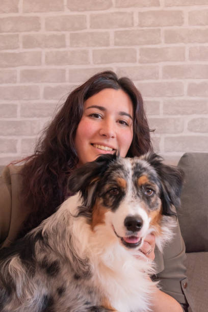 istock Young woman with her dog both looking at the camera. 1483573751