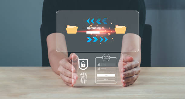 istock businesswoman upload documents from computer to backup online cloud and download copy file data from cloud network for make work in office or from home. cybersecurity concept Global network security. 1483573811