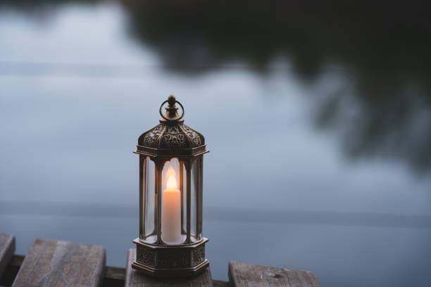 istock Ramadan Kareem, Arabic lantern with burning candle with blurry natural background.Image for Festive greeting card,invitation for Muslim holy month,Eid Mubarak,Eid al Adha,Eid al Fitr 1483574052