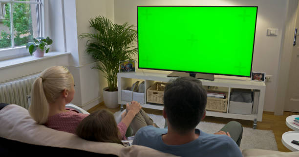 istock Family watching TV 1483580324