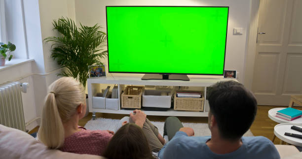 istock Family watching TV 1483580326