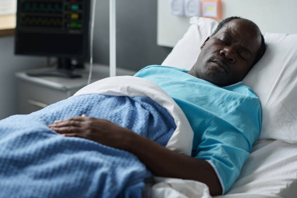 istock Unconscious patient lying in hospital ward 1483580567