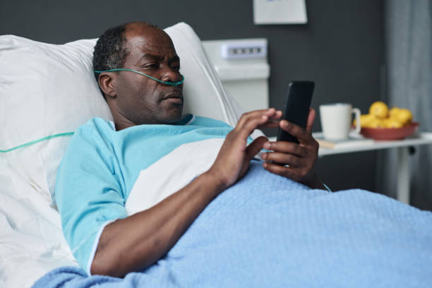 istock Elderly patient using smartphone in hospital 1483580838