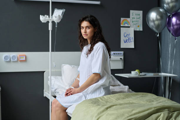 istock Woman with dropper sitting in ward 1483583846