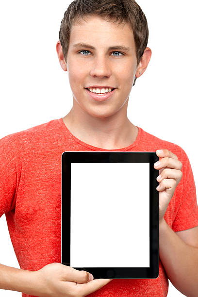 istock smiling boy holding a tablet with an insulated screen 148358911